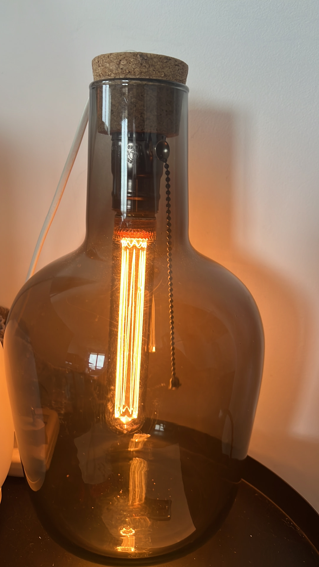 Lamp 03, Upcycled smoked-glass demijohn, cork, pull-chain socket, Edison filament bulb